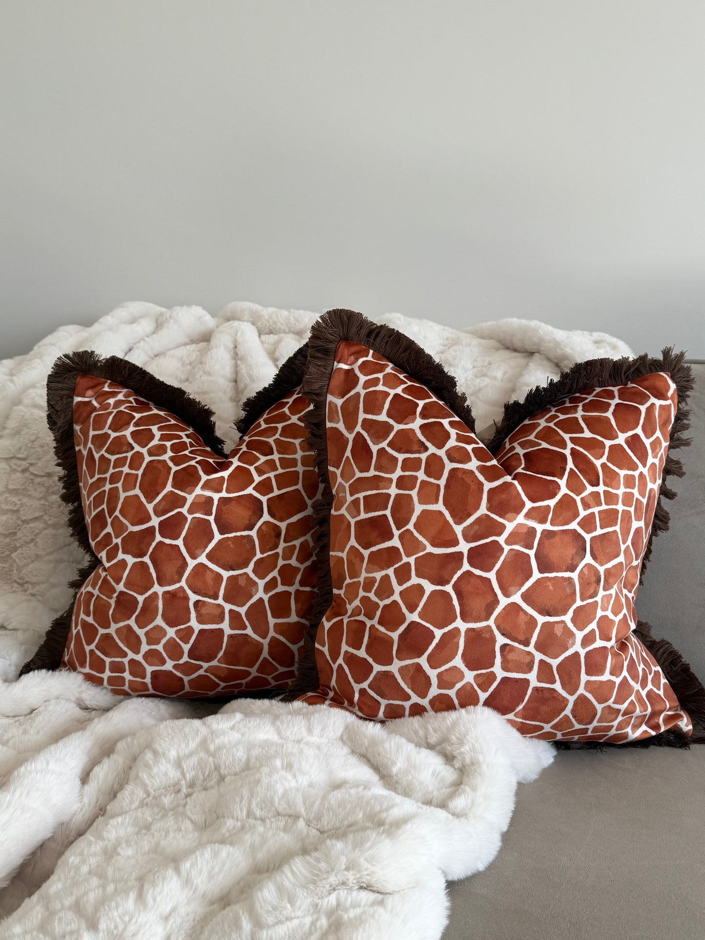 Rust Orange Giraffe Print Cushion with Fringe Trim
